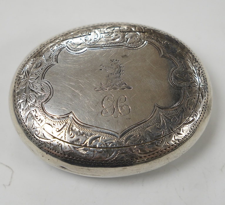 An Edwardian engraved silver oval tobacco box, Hilliard & Thomason, Birmingham, 1901, 75mm. Condition - poor to fair